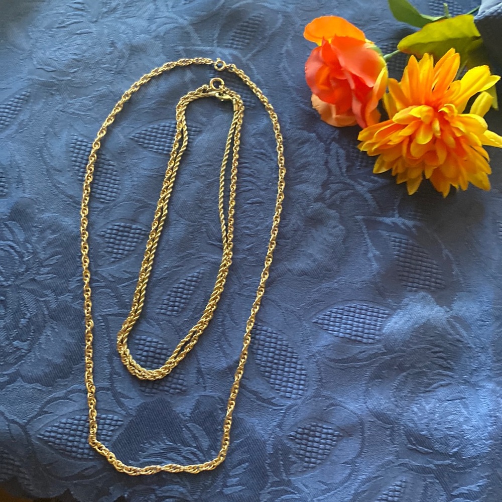 Three gold tone braded chains.